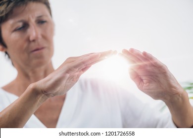 Horizontal Image Of Professional Reiki Healer Doing Reiki Distance Healing Treatment. Alternative Therapy Concept