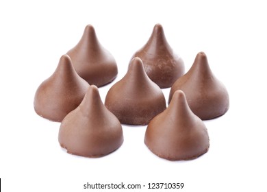 Horizontal image of sweet chocolate kisses isolated over the white background