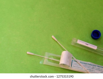 Horizontal Image Of A Test Tube And Sterile Swabs Used To Collect Saliva Or Cheek Cells, Nasal Swab For Testing DNA (genetics), Hormones, Viral Antigens, Virus Or Drug Screening.  Room For Copy (text)
