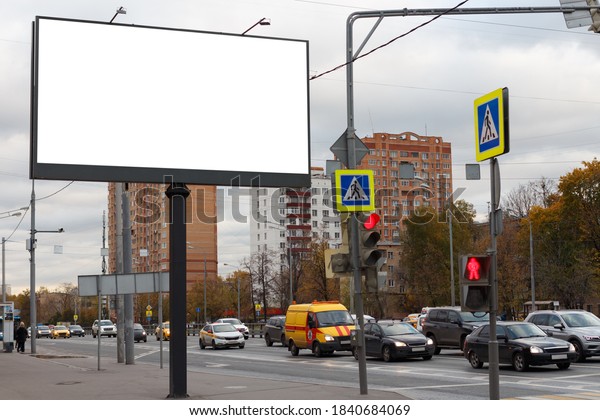 Horizontal large billboard near the roadway in\
the city. Mock-up