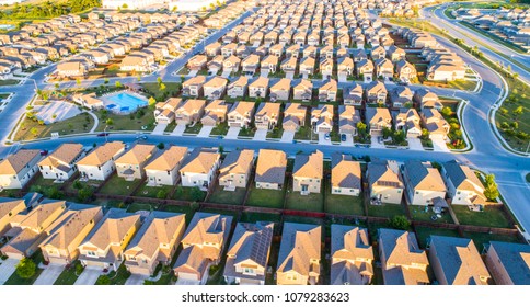 Horizontal Lines Suburb Housing Neighborhood Homes In Suburbia - Aerial Drone View - Above Austin , Texas , USA Perfect Cubed Square Houses Living Area In Real Estate Suburban Community At Sunset