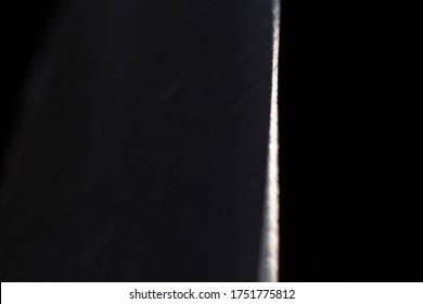 Horizontal Macro Detail Of Sharp Stainless Steel Chef Knife Against Black Background. Simple, Minimalistic Photo Of Edge Of Razor-sharp Knife