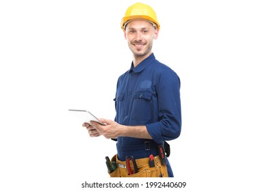 Horizontal medium portrait of successful handsome young adult Caucasian construction engineer wearing uniform using digital tablet, white background - Powered by Shutterstock