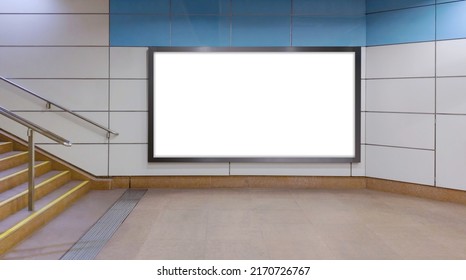 Horizontal mock up of blank advertising billboard poster template next to a flight of stairs; out-of-home OOH media display space mockup in pedestrian underpass; digital display in train station - Shutterstock ID 2170726767