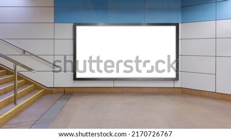 Horizontal mock up of blank advertising billboard poster template next to a flight of stairs; out-of-home OOH media display space mockup in pedestrian underpass; digital display in train station