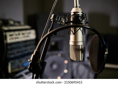 Horizontal No People Shot Of Condenser Microphone With Disc Pop Filter In Modern Recording Studio