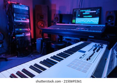 Horizontal No People Shot Of Modern Recording Studio Workplace Interior With Mixing Console, Digital Keyboard, Loudspeakers And Other Equipment