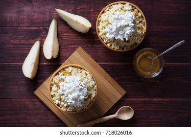 Horizontal Overhead Photo Of Millet Porridge With Pear And Cottage Cheese