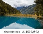 Horizontal panoramic image of the mirror reflection waters of the Jiuzhaigou Valley Lake, Aba Tibetan Autonomous Prefecture, Sichuan, China. UNESCO World Heritage site in China 