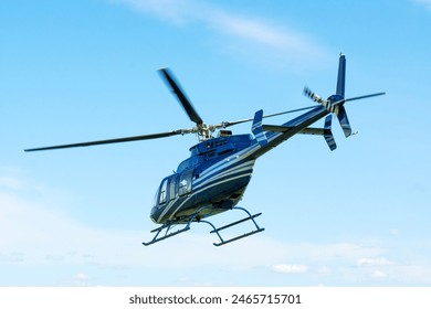 A horizontal photo of a Bell helicopter in flight