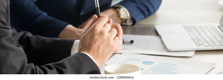 Horizontal Photo Businessmen During Meeting Brainstorm Negotiate Use Charts Graphs Sales Analyse Stats Shown At Paper Document Share Thoughts Ideas. Teamwork Concept, Banner For Website Header Design