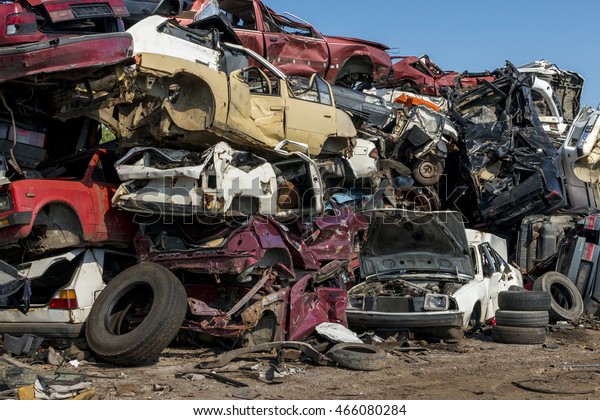 Horizontal photo of a car scrap\
yard