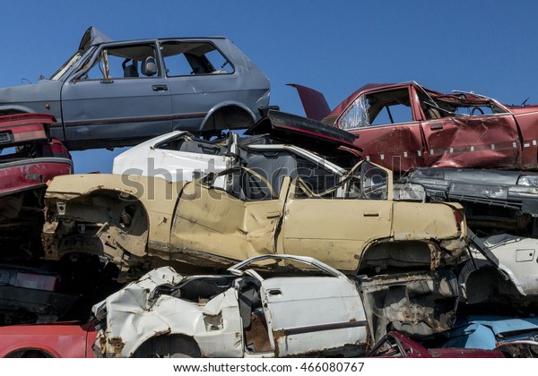 Horizontal photo of a car scrap\
yard