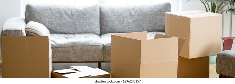 Horizontal Photo Heap Of Cardboard Boxes With Personal Belongings In Living Room At Moving Relocation Day No People, Delivery Service Concept, Banner For Website Header Design With Copy Space For Text