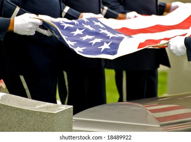 Horizontal Photo Of Honor Guard Holding Flag Over Casket At Arlington National Cemetery