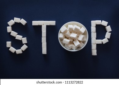 Horizontal Photo Of Sugar STOP Sign On Dark Blue Background