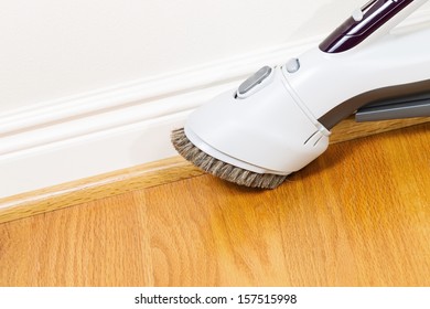 Horizontal Photo Of Vacuum Cleaner Brush Extension Cleaning Floor And Trim Work 