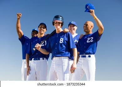 Horizontal Portrait Of A Baseball Team In Blue Uniform Celebrating Victory Post-match.