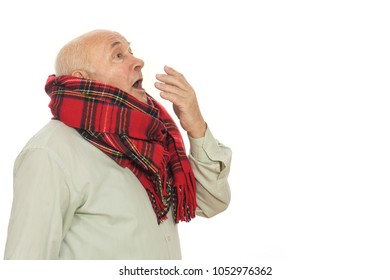 Horizontal Portrait Of An Old Sick Man Sneezing Wearing A Scarf Isolated On White Posing At Studio Copy Space Seniority Health Patient Medicine Sympthoms Concept.