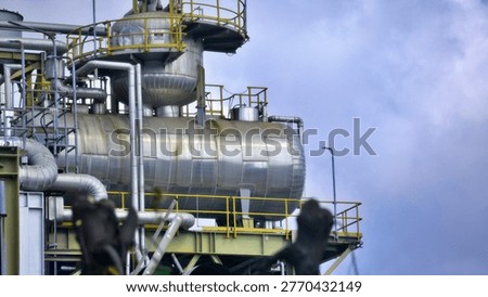 Horizontal Pressure Vessel On Elevated Steel Structure At Refinery