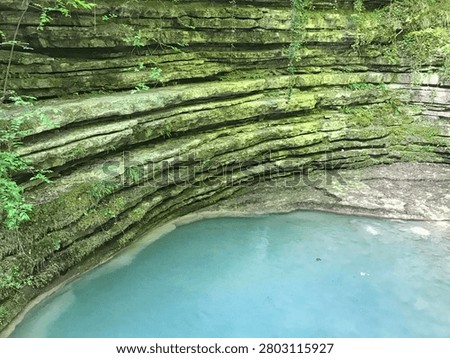 The horizontal rock formations (stepped structure) in the image, the turquoise pool where the water cascades, and the dense green vegetation surrounding them are the features of these waterfalls in Erfelek, Sinop.