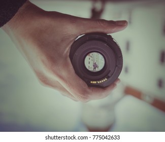 A Horizontal Rotated Image Of A Photographic View Of A Statue Of A Man On A Horse Through A Camera Lens Glass Held By A Photographer’s Hand During Mid Day. Captured In Bratislava, Capital Of Slovakia.