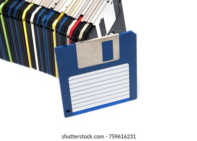 horizontal row of computer floppy disks isolated on a white background.