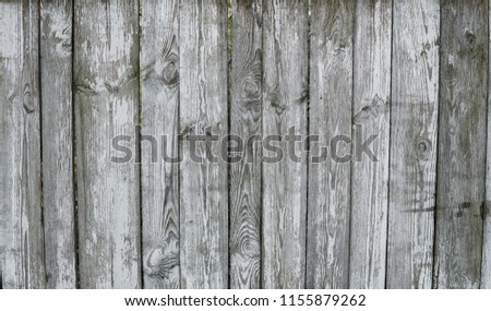 Horizontal rustic weathered old painted wood background with knots and nail holes. Woods texture.