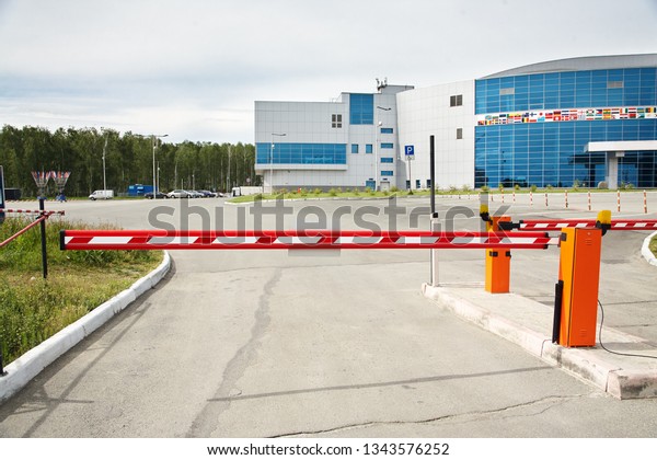 horizontal\
security barrier at entrance to a car\
park