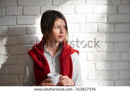 Horizontal shot of a beautiful young woman looking away thoughtfully while enjoying a cup of coffee in the morning copyspace lifestyle leisure teenager relaxation urban cafe coffee shop.