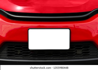 Horizontal Shot Of A Blank White Front License Plate On A Red Car With Copy Space.