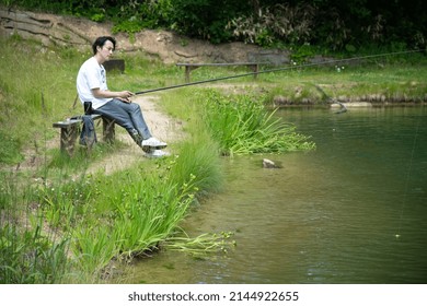 A horizontal shot of Businessman Enjoying Fishing