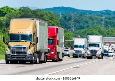 Horizontal Shot Of Busy Truck Traffic On An Interstate Highway.