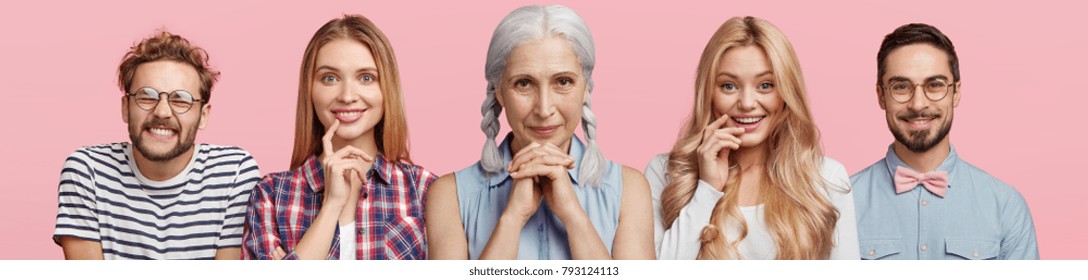 Horizontal Shot Of Five People Have Different Age And Interests, Express Various Emotions And Facial Expressions, Isolated Over Pink Background. Grey Haired Woman, Two Blonde Females And Bearded Men