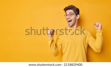 Similar – Image, Stock Photo A handsome man with green eyes with a vegetation background