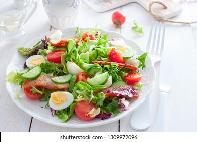 Horizontal Shot Of Large White Bowl Of Deviled Egg Salad On Dark Wooden Background