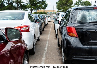 Horizontal Shot Of A Line Of Bland Cars On An Airline Rental Agency Parking Lot.