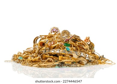 Horizontal shot of a lovely collection of gold jewelry with reflection and copy space.