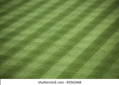 Horizontal Shot Of Manicured Outfield Grass At A Baseball Stadium.