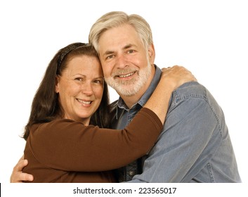 Horizontal Shot Of Middle Aged Couple Smiling On A White Background