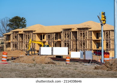 Horizontal Shot Of New Apartment Construction With Three Blank Signs