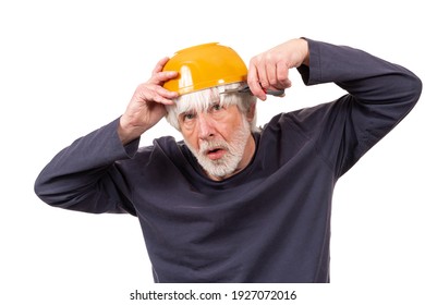 Horizontal Shot Of An Old Man Giving Himself A Haircut Using A Yellow Kitchen Bowl On His Head During The Pandemic.  White Background.