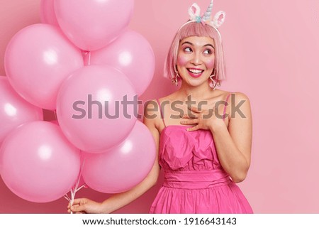 Image, Stock Photo woman with pink wig smiling happily on pink background