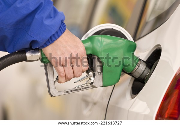 Horizontal Shot Of Pumping Gas/ Pumping Precious\
Gas Or Petrol