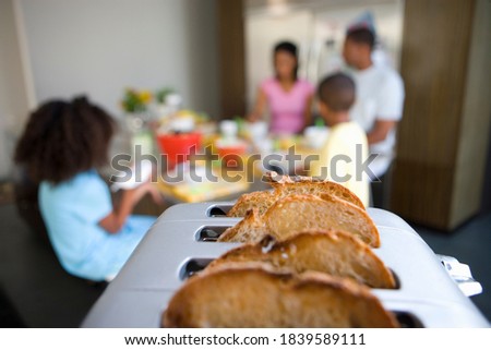 Similar – Image, Stock Photo Toasted toast bread in toaster on pink background