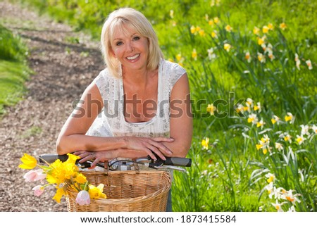 Similar – Image, Stock Photo Blonde woman leaning on a white wall while looking camera