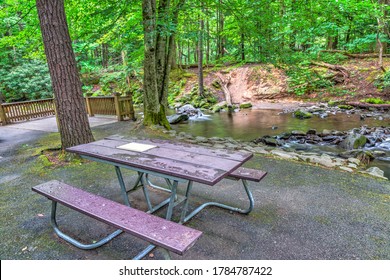 Horizontal Shot Of A Smoky Mountain Picnic Table In Early Morning Light.