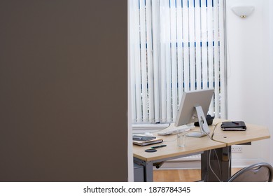 Horizontal Shot Of An Unoccupied Desk In An Office Cabin With Copy Space.