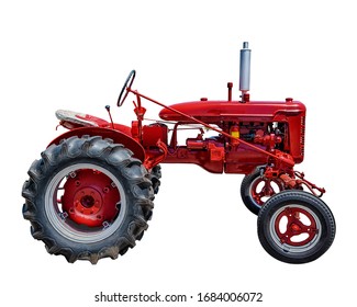 Horizontal shot of a vintage red tractor on a white background.  Copy space.