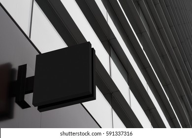 Horizontal side view of empty black signage on business skyscraper with modern architecture and glass windows 